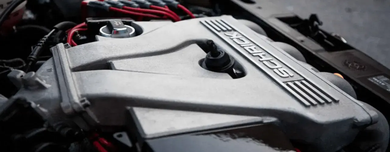 A close up image of car engine.